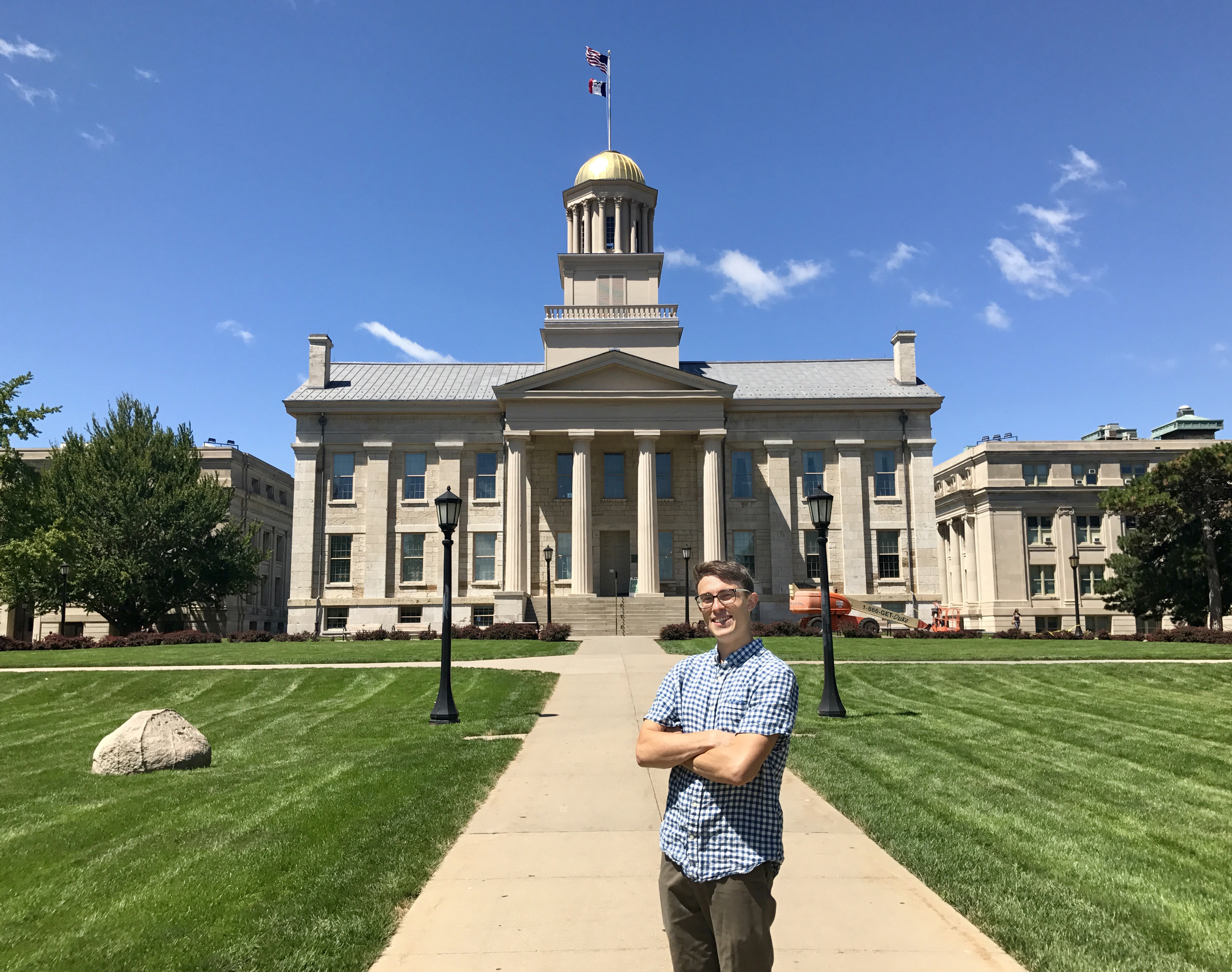 Ryan Hall standing in front of UI Old Capital building